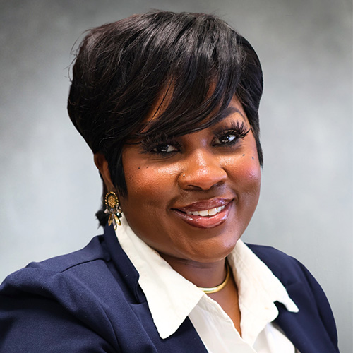 Brittany Adams, Parrish St. Branch Manager at M&F Bank, smiling in professional attire against a neutral background.